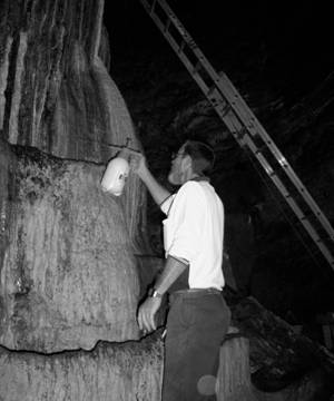 Bruce Day applying calcium hypochlorite